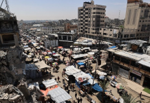 The tiring task of repairing Gaza’s tattered banknotes