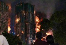Fire engulfs Hong Kong residential blocks, killing at least 13 Fire engulfs Hong Kong residential blocks, killing at least 13
