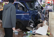 Truck crashes into market, killing 2, injuring 18