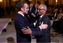 Read all about it! Macron gives honour to last newspaper hawker in Paris