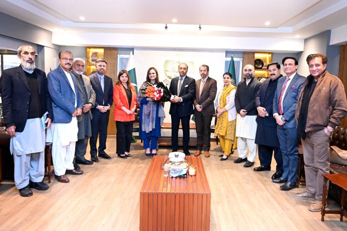 RCCI President Usman Shaukat presenting bouquet to Chief Commissioner Inland Revenue during her visit to the chamber house.