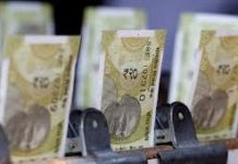 Indian rupee hits record low, puts central bank on defensive amid inflation fears