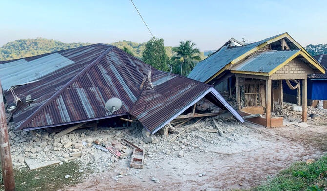 Magnitude 7.7 earthquake strikes off Indonesia's coast, toppling buildings and killing at least 2