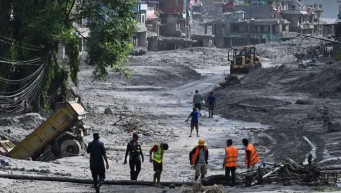NEWS Rescuers dig into tunnel as missing toll from Nepal, China flood tops 3,000