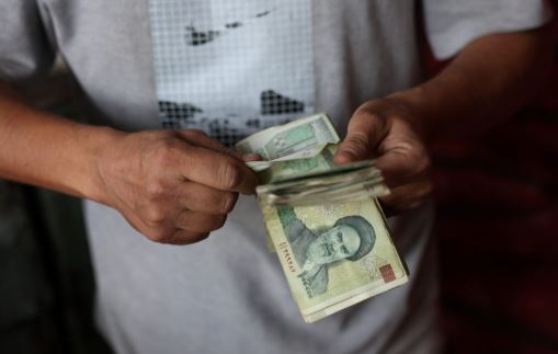 NEWS Iran’s currency hits a new record low